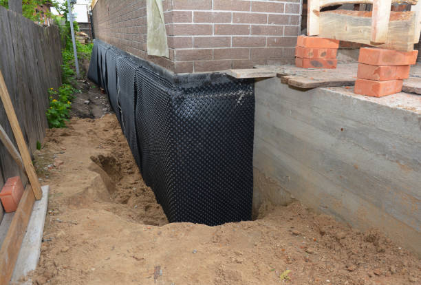 Happy homeowners after waterproofing job in Whitewater